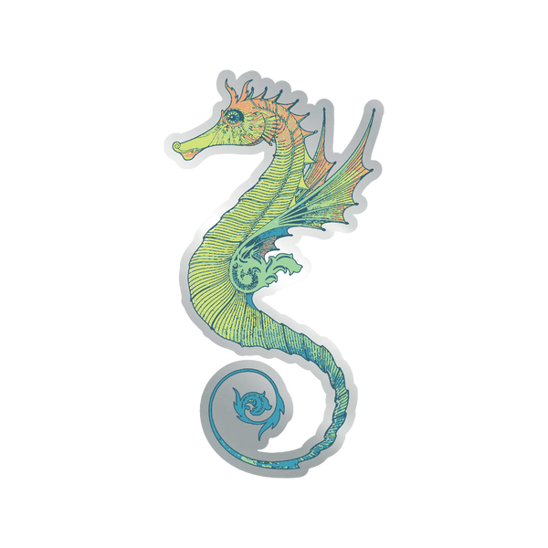 The Isle of Wight Festival 2025 Seahorse Pin Badge by 2025 features a colorful, whimsical seahorse with a green and yellow body, orange head, fin-like wings, and curled blue tail on a transparent background.
