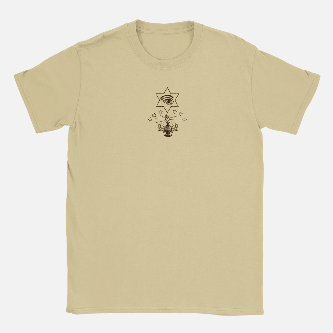 Tan, 100% ring-spun cotton Renaissance Ritual T-shirt with a crew neck, featuring a small chest graphic of an eye inside a star above a burning oil lamp.