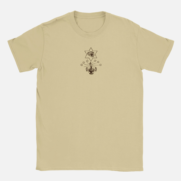 Tan, 100% ring-spun cotton Renaissance Ritual T-shirt with a crew neck, featuring a small chest graphic of an eye inside a star above a burning oil lamp.