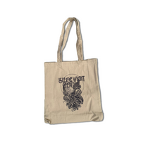 The Isle of Wight Festival 2025 Peacock Tote Bag by 2025 is a beige tote with long handles, a black graphic design, and “Isle of Wight Festival 2025” on the front, plus artistic patterns—perfect for stylishly carrying your essentials.